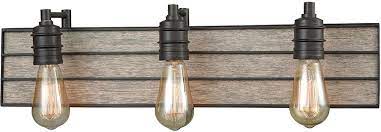 Constructed of formed steel and finished in oil rubbed bronze, the frosted glass and curved construction will add a touch of style to any room. Elk 16441 3 Brookweiler Oil Rubbed Bronze 3 Light Bathroom Vanity Light Fixture Elk 16441 3