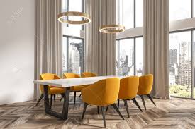 Frontier furniture allows you to choose the style, stain, color, wood type, upholstery and more! White Dining Room Corner With A Wooden Floor A Long Table With Stock Photo Picture And Royalty Free Image Image 93295146