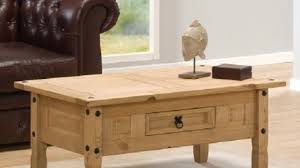 Wooden one, which can have various styling: Aztec Corona Mexican Pine Coffee Table 51 97 Gardens Homes Direct