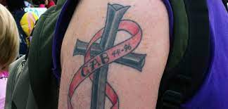 Talk to the tattoo artist to get a flower design that you like. Pink Ink A Ribbon Cross Tattoo For Mom My Pink Ink