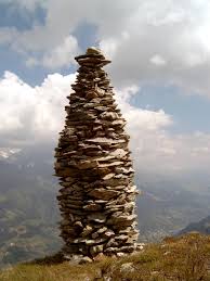 The larger the base, the more stable the object is. Cairn Wikipedia