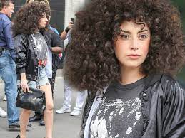 This lady gaga curly blonde wig is an officially licensed lady gaga costume accessory. Lady Gaga S Eighties Makeover Sees Her In Curly Brown Wig And Shiny Bomber Jacket Mirror Online