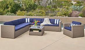 A sectional helps to define the lounge; Solaura 7 Piece Outdoor Sectional Furniture Gray Wicker Conversation Sofa Set With Navy Blue Cushion Glass Coffee Table Buy Online In Bahamas At Bahamas Desertcart Com Productid 96545905