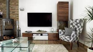 Wohnzimmer Dunkler Boden Heller Teppich Glastisch Dunkle Wohnwand Grosser Flachbildfernseher Kaminofen Braun Weiss Ge Fertighauser Glastische Teppich Wohnzimmer