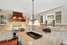 White ornamental granite color is a very colorful stone that goes well with darker cabinetry. Giallo Ornamental Granite Countertops Pictures Cost Pros And Cons Kitchen Remodel Countertops Giallo Ornamental Granite Diy Kitchen Countertops