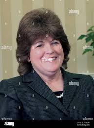 U.S. Secret Service Director Julia Pierson, center, is welcomed by Rep.  Darrell Issa, R-Calif., chairman of the House Oversight Committee, and Rep.  Elijah Cummings, D-Md., far left, the ranking member, as she