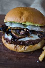 While the burgers are cooking saute the freshly sliced mushrooms and onions over medium heat until deep brown and tender. Mushroom Burger With Provolone Caramelized Onions And Aioli