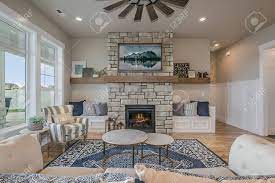 A fireplace or hearth is a structure made of brick, stone or metal designed to contain a fire. Beautiful Blue Rug And Stone Fireplace In Great Room Of Open Stock Photo Picture And Royalty Free Image Image 145213722