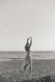 New design the best black and white photography wallpapers. Black And White Image Of Joyful Woman Walking On The Beach At Sunset Nature Outdoors Background Stock Photo Picture And Royalty Free Image Image 69760800