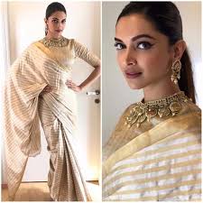 She has revamped the way we look at a saree. Deepika Padukone Makes A Strong Case For Metallic Sarees In This Look For Padmavati Promotions Deepika Padukone Saree Saree Look Elegant Saree