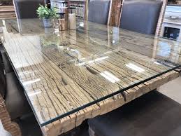One Of Our Rustic Handcrafted Reclaimed Wood Dining Tables Protected By Generously T Reclaimed Wood Dining Table Wood Dining Table Wood Dining Table Rustic