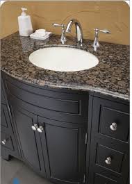 Granite is a durable stone. Baltic Brown Counter Black Cabinet Brown Granite Granite Bathroom Baltic Brown Granite