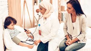 Arabic Female Doctor Checking Blood Pressure Boy Child At The