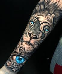 Lion tattoo meaning encompasses power, courage, pride, strength, and even royalty, so can match nicely for the collector looking for an eye catching visible tattoo. Art Amazing Blue Eyes Lion Eye Arm Tattoo By Awesome