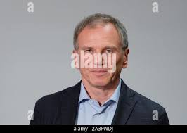 08 October 2019, Saxony, Leipzig: Armin Wolf (l-r), television presenter  from Austria, Arndt Ginzel, journalist, and Gerald Gerber, cameraman, stand  together for the group picture. All three are awarded the Prize for