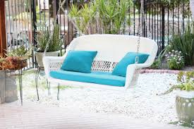 (chiefly britain) a reclining chair with a long seat. Jeco Honey Resin Wicker Hanging Porch Swing With Cushion In Blue Gliders Chairs Ekoios Vn