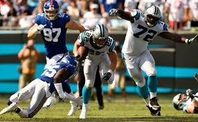 Men in tights and giant pads crash into each other, all while we cheer along in the stands (or, more likely, at home) and stuff our. Christian Mccaffrey Christian Mccaffrey Photos New York Giants Vs Carolina Panthers Zimbio
