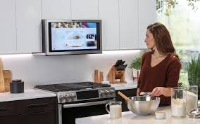 Integrated range hood designer stefani stein created a seamless look in this kitchen where the range blends right in to the subway tile walls. Ge Kitchen Hub Smart Range Hood With 27 Inch Display At Ces 2019