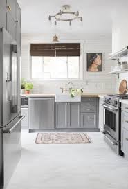 The white painted walls and kitchen cabinets can blend perfectly with the grey floor. Before And After A Small Pittsburgh Kitchen Gets A Complete Makeover In 6 Days Grey Kitchen Floor White Kitchen Floor Vinyl Flooring Kitchen