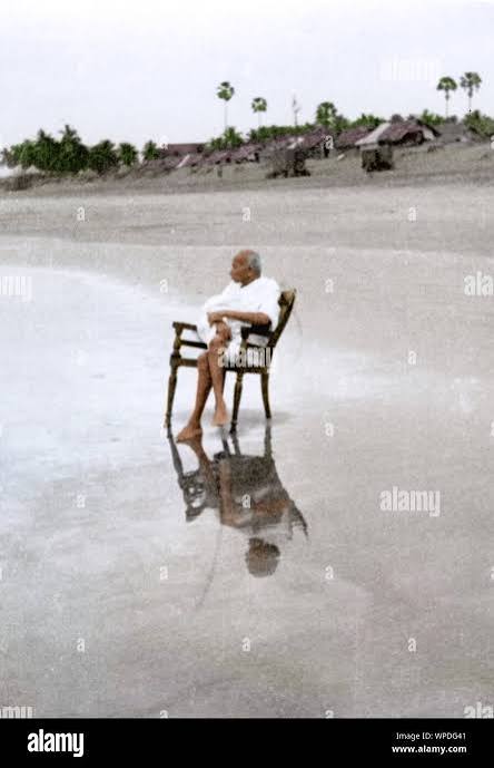 Mahatma Gandhi sitting alone, Juhu Beach, Bombay, Mumbai, Maharashtra, India, Asia, May 1944 Stock Photo - Alamy