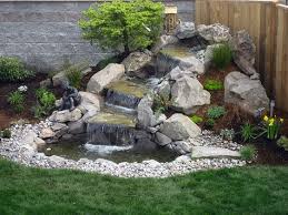 Water from the pump gurgles up through the hole and overflows the stone. Easy Diy Garden Water Features How To Garden Gardening Tips Water Features In The Garden Waterfalls Backyard Backyard Water Feature