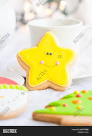 Christmas cookies decoration women decorating gingerbread cookies, christmas is near and she prepare for holidays. Decorated Star Shaped Image Photo Free Trial Bigstock