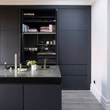 Gray kitchen pantry with black granite countertops displaying stacked cabinetry with satin nickel pulls and knobs. Grey Kitchen Ideas 30 Design Tips For Grey Cabinets Worktops And Walls