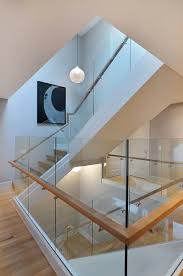 Metal and glass railings create a sleek and contemporary design, perfect for staircases, balconies, windscreens, and decks. Modern Glass Railings Houzz