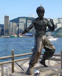 The majestic flag diorama enhances the magnificent charm of the statue. Bruce Lee Statue In Front Of Victoria Harbour And The Hong Kong Skyline Photo Taken By Bradjill Bruce Lee Bruce Lee Quotes Victoria Harbour