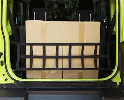 Urban version of a practical compact suv. Suzuki Jimny 4 Kofferraum Gepack Netz