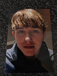Can someone tidy up this pic of my 17 yearold grandson so that he is  smiling init we lost last him week thank you