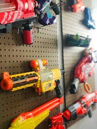 Right now, one of their favorite things is nerf guns. Diy Pegboard Nerf Gun Storage Moments With Mandi