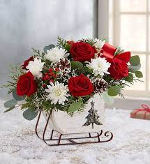 Dashing Through The Snow Sleigh Christmas Flowers Christmas Floral Arrangements Christmas Flowers Centerpieces