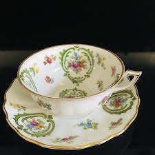 Porcelain tea cup and saucer with floral pattern part tea service. Saxe Tea Cup And Saucer Germany Fine Bone China Green Scrolls Gold Trim Dresden Flower Pattern Orange Purple Yellow Farmhouse Collectible Carol S True Vintage And Antiques