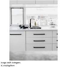 Black kitchen cabinets are a less complex color palette instead opting for monochrome style with splashes of grey to soften the contrast. Black Cabinet Handle By Meir Black Kitchen Handles Matte Black Kitchen White Kitchen Design
