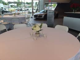 White Hercules Chairs And 60 Round Tables At The Jim Ellis Audi Atlanta Showroom Party Event Ren Pool Lounge Chairs Table Linen Rentals Patterned Armchair
