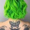 She had a couple darker spots from me missing some when i bleached but other than that her hair is soooo neon green! 3
