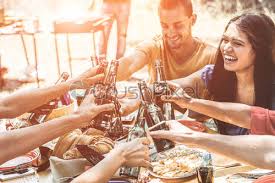 The negroni is back in fashion and rightly so, as it makes the perfect aperitif. Happy Millennial Friends Cheering With Beers At Barbecue Dinner Party Stock Photo Crushpixel
