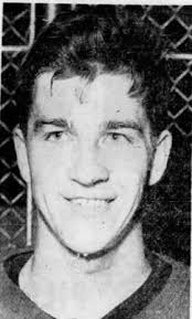 Ned Harkness, seated here between Alex Delvecchio and Mr. Hockey was GM and  coach for the Red Wings. He's also a US Hockey Hall of Famer. In 1976 while  playing for University