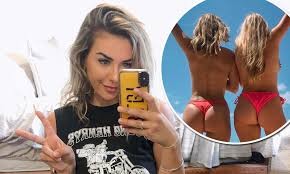 Shelby Bilby poses in white lingerie revealing her delicate allure