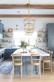 This monochrome farmhouse kitchen utilizes barn board as racks to keep the utensils and cutlery on one space. 25 Inspiring Coastal Kitchen Decor Ideas Shelterness
