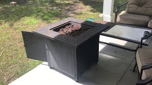 The fire pit has an antique bronze finish with a natural slate tabletop and a black base that holds a propane tank. How To Light A Gas Fire Pit Endless Summer Fire Pit Youtube