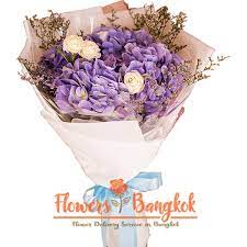 Fill their senses with the majestic beauty of our hydrangea. Pure Love Bouquet Flower Delivery In Bangkok