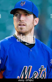 New York Mets' Ike Davis (29) high-fives John Buck (44) after hitting a  two-run home run off Nationals relief pitcher Drew Storen in the eighth  inning of a baseball game at Citi