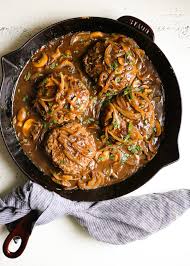 Hamburger steaks are made with an onion and mushroom gravy ensuring the steak is never dry and always flavorful. Southern Style Hamburger Steaks With Onion And Mushroom Gravy The Defined Dish