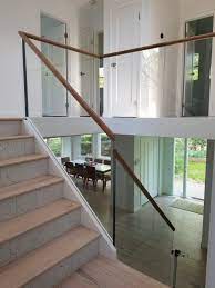 Minimal Glass Railing With A Wood Cap Rail Glass Railing Stairs Glass Stairs Loft Railing