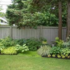 Pin By Regina Baker On Garden Landscaping Along Fence Backyard Fences Backyard Landscaping