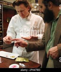 APN ADVANCE FOR SUNDAY MAY 25** Eddy Leroux, chef de cuisine at Daniel,  left, listens as Behroush Sharifi talks about one of his new spice  offerings in the kitchen of Daniel, Wednesday