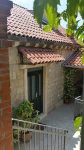 Tile Awning Stone Door Frame House Awnings House Exterior Spanish House Exterior