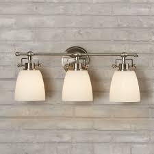 It features a solid and engineered wood base with a white stone countertop and backsplash. Meyer 3 Light Dimmable Brushed Nickel Vanity Light Bath Vanity Lighting Vanity Lighting Bathroom Vanity Lighting